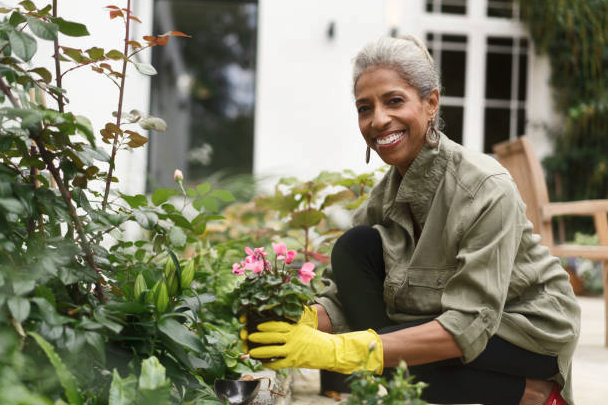 Person with dementia gardening with help