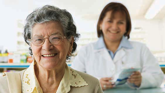 Elderly person being supported by a healthcare worker