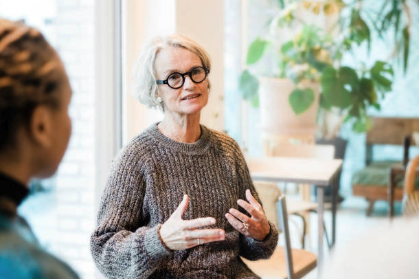 Support group of elderly people talking together